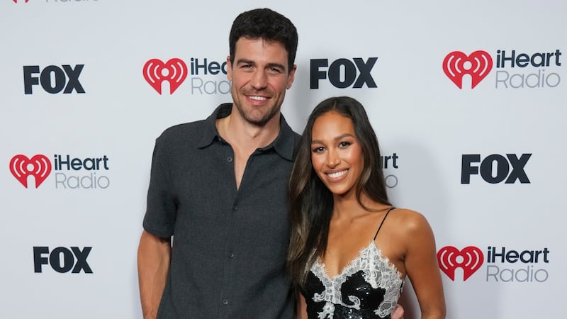 Joe Amabile, left, and Serena Pitt arrive at the iHeartRadio Music Awards, Monday, March 17,...