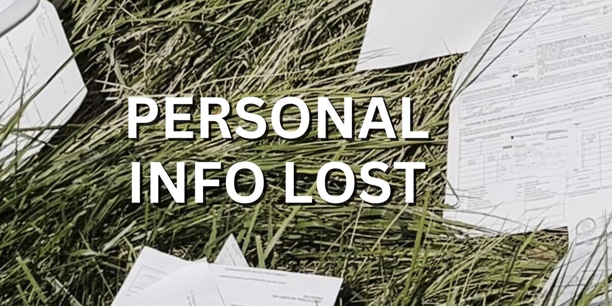 Records with personal info blowing around interstate off-ramp