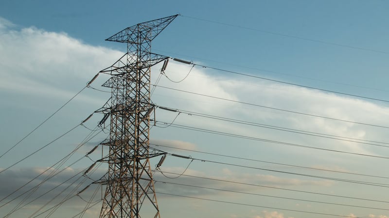Transmission lines carry high-voltage electricity across large geographic areas from power...