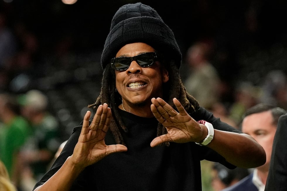 FILE - Jay-Z gestures from the sidelines prior to the NFL Super Bowl 59 football game, Feb. 9,...